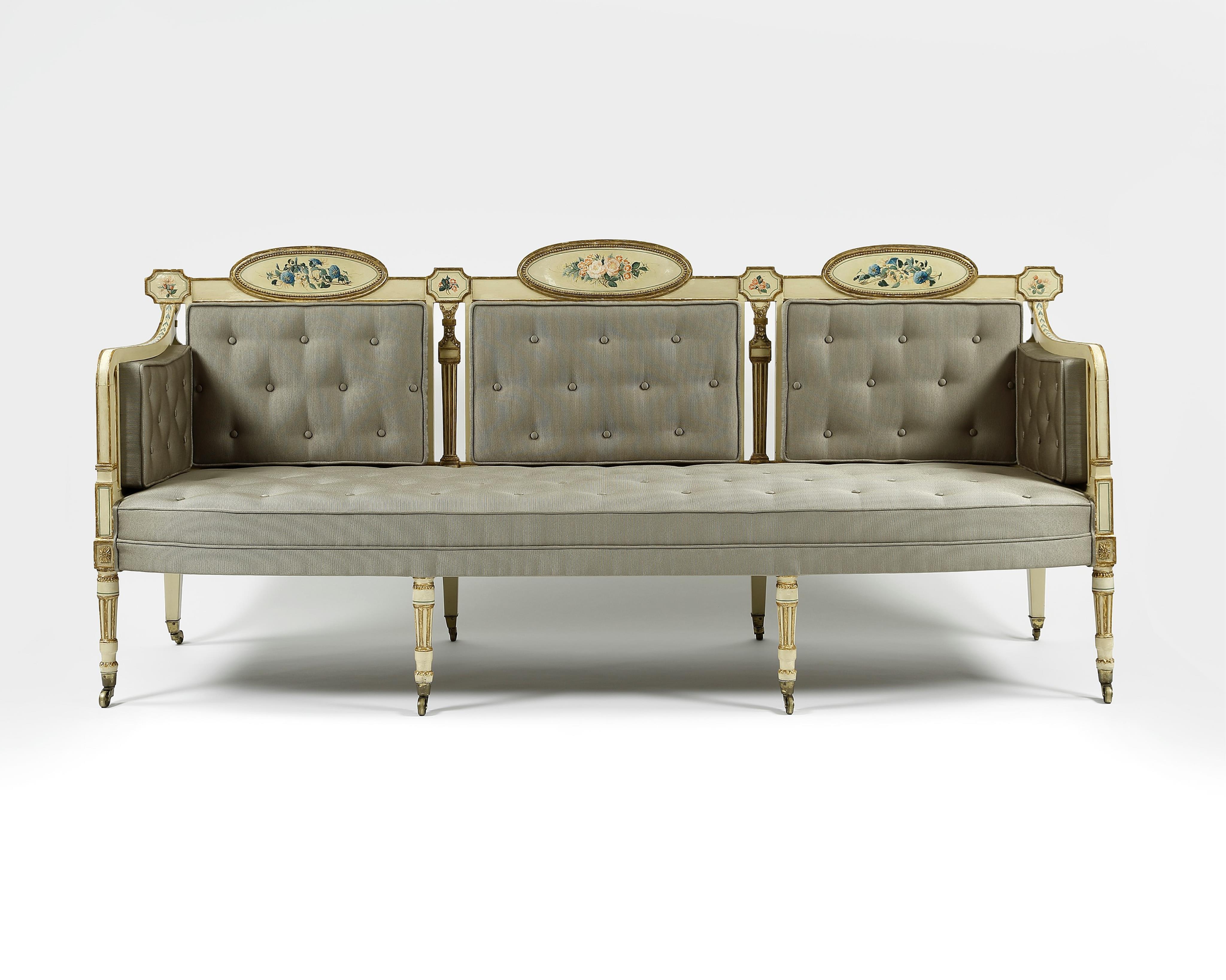 A pair of George III cream painted and parcel gilt settees, in the manner of George Brookshaw (1751-1823)